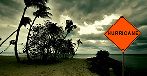 hurricane warning sign in front of ominous weather