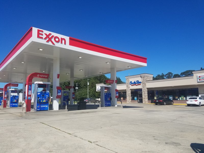 external shot of convenience store and EXXON fuel pumps